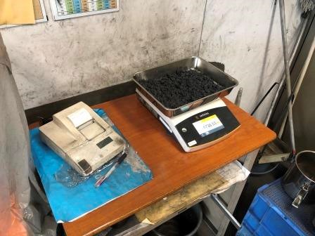 Weighing wet weight of moisture test samples